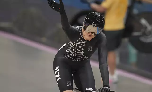 Ellesse Andrews of New Zealand waves after winning the women's keirin semifinal event, at the Summer Olympics, Thursday, Aug. 8, 2024, in Paris, France. (AP Photo/Thibault Camus)