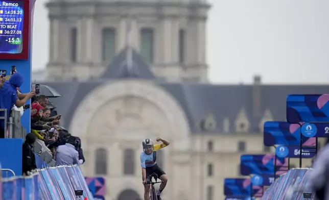 Remco Evenepoel, of Belgium, wins the men's cycling time trial event, at the 2024 Summer Olympics, Saturday, July 27, 2024, in Paris, France. (AP Photo/Ricardo Mazalan)