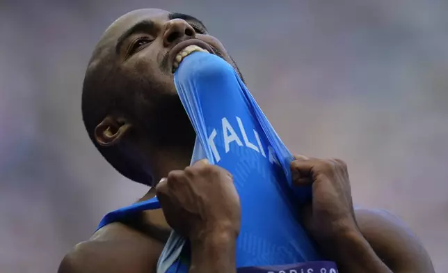 Diego Aldo Pettorossi, of Italy, reacts after his men's 200-meters repechage at the 2024 Summer Olympics, Tuesday, Aug. 6, 2024, in Saint-Denis, France. (AP Photo/Petr David Josek)