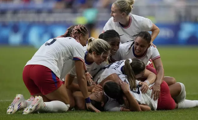 United States' Sophia Smith celebrates the opening goal with teammates during a women's semifinal soccer match between the United States and Germany at the 2024 Summer Olympics, Tuesday, Aug. 6, 2024, at Lyon Stadium in Decines, France. (AP Photo/Silvia Izquierdo)