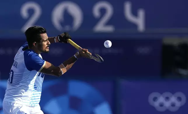 India's Sanjay Sajay controls the ball during the men's semi-final field hockey match between Germany and India at the Yves-du-Manoir Stadium during the 2024 Summer Olympics, Tuesday, Aug. 6, 2024, in Colombes, France. (AP Photo/ Anjum Naveed)