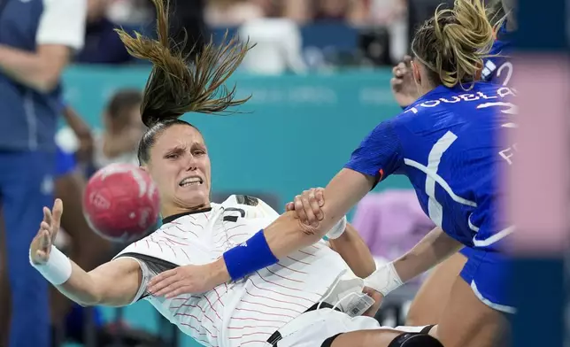 Germany's Xenia Smits is in action during a quarterfinal handball match between France and Germany at the 2024 Summer Olympics, Tuesday, Aug. 6, 2024, in Villeneuve-d'Ascq, France. (AP Photo/Aaron Favila)