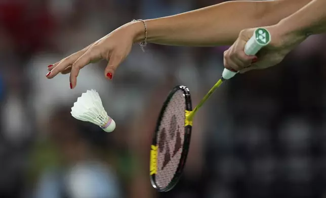 Spain's Carolina Marin serves a ball to Switzerland's Jenjira Stadelman during their women's singles badminton group stage match at the 2024 Summer Olympics, Sunday, July 28, 2024, in Paris, France. (AP Photo/Kin Cheung)