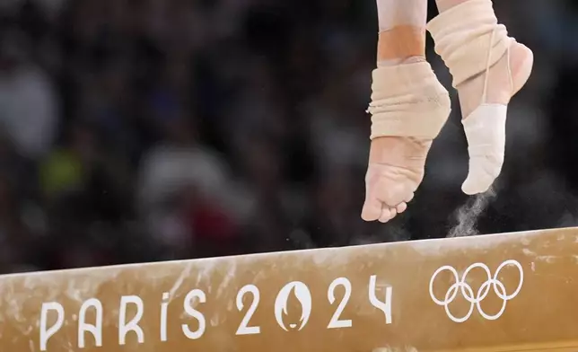 Georgia-Mae Fenton, of Great Britain, competes on the balance beam during a women's artistic gymnastics qualification round at the 2024 Summer Olympics, Sunday, July 28, 2024, in Paris, France. (AP Photo/Charlie Riedel)