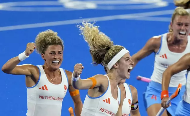 Netherlands' Yibbi Jansen, center, celebrates after scoring her side's first goal during the women's gold medal field hockey match between China and Netherlands at the Yves-du-Manoir Stadium during the 2024 Summer Olympics, Friday, Aug. 9, 2024, in Colombes, France. (AP Photo/Aijaz Rahi)
