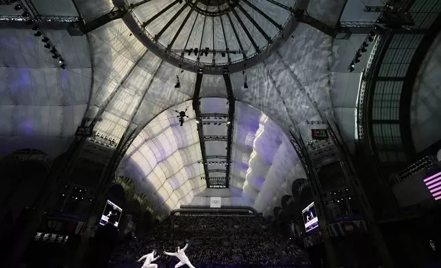 Czech Republic's Jiri Beran, left, competes with France's Yannik Borel in the men's team epee bronze final match during the 2024 Summer Olympics at the Grand Palais, Friday, Aug. 2, 2024, in Paris, France. (AP Photo/Abbie Parr)