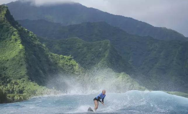 Tatiana Weston-Webb, of Brazil, surfs during the gold medal match of the surfing competition at the 2024 Summer Olympics, Monday, Aug. 5, 2024, in Teahupo'o, Tahiti. (AP Photo/Gregory Bull)