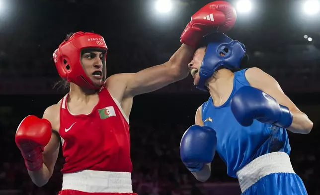 Algeria's Imane Khelif, left, fights China's Yang Liu in their women's 66 kg final boxing match at the 2024 Summer Olympics, Friday, Aug. 9, 2024, in Paris, France. (AP Photo/Ariana Cubillos)