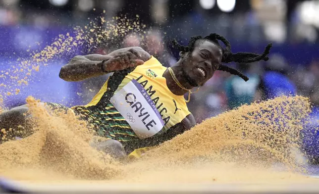 Tajay Gayle, of Jamaica, competes in the men's long jump qualification at the 2024 Summer Olympics, Sunday, Aug. 4, 2024, in Saint-Denis, France. (AP Photo/Matthias Schrader)