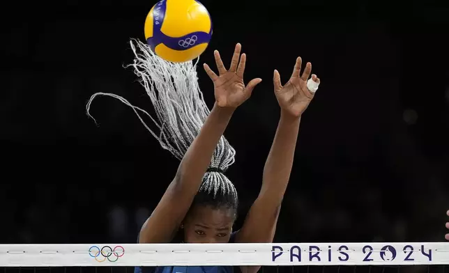 France's Amandha Sylves blocks a ball during the group A women's volleyball match between France and Serbia at the 2024 Summer Olympics, Monday, July 29, 2024, in Paris, France. (AP Photo/Alessandra Tarantino)