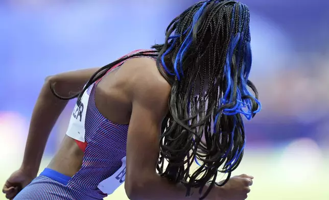 Aaliyah Butler, of the United States, prepares to run in a women's 400 meters round 1 heat at the 2024 Summer Olympics, Monday, Aug. 5, 2024, in Saint-Denis, France. (AP Photo/Martin Meissner)