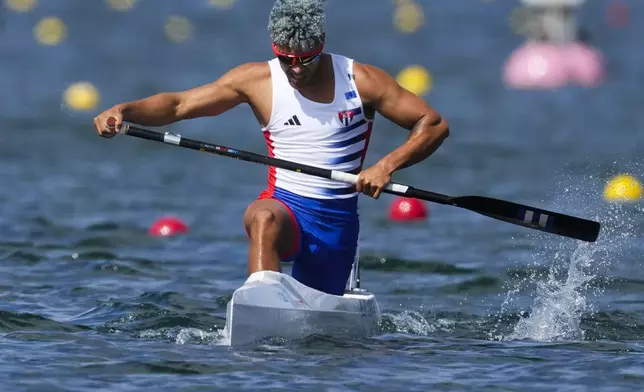 Jose Ramon Pelier Cordova, of Cuba, competes in the men's canoe single 1000-meter heats at the 2024 Summer Olympics, Wednesday, Aug. 7, 2024, in Vaires-sur-Marne, France. (AP Photo/Lindsey Wasson)