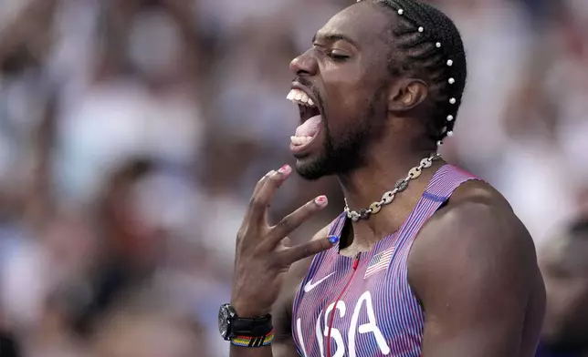 Noah Lyles, of the United States, reacts ahead of his men's 100-meters semifinal at the 2024 Summer Olympics, Sunday, Aug. 4, 2024, in Saint-Denis, France. (AP Photo/Bernat Armangue)