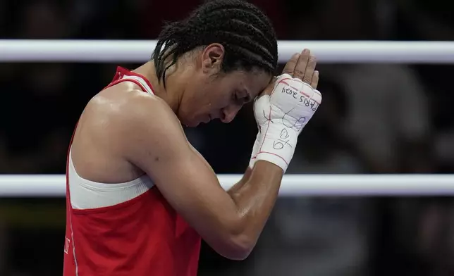 Algeria's Imane Khelif, celebrates after defeating Hungary's Anna Hamori in their women's 66kg quarterfinal boxing match at the 2024 Summer Olympics, Saturday, Aug. 3, 2024, in Paris, France. (AP Photo/John Locher)