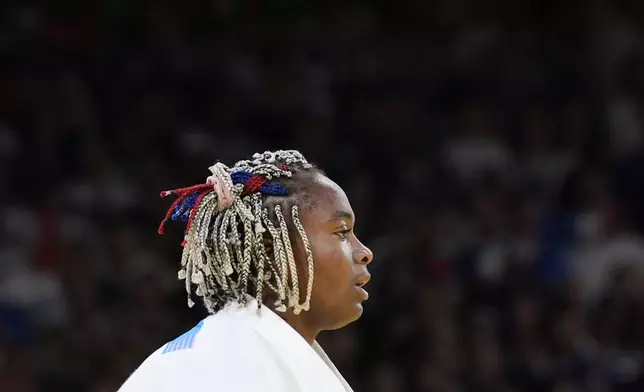 France's Romane Dicko reacts after the women's +78 kg semifinal match against Brazil's Beatriz Souza in the team judo competition, at Champ-de-Mars Arena, during the 2024 Summer Olympics, Friday, Aug. 2, 2024, in Paris, France. (AP Photo/Eugene Hoshiko)