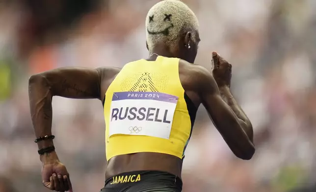 Janieve Russell, of Jamaica, starts in her women's 400-meters hurdles semifinal at the 2024 Summer Olympics, Tuesday, Aug. 6, 2024, in Saint-Denis, France. (AP Photo/Petr David Josek)