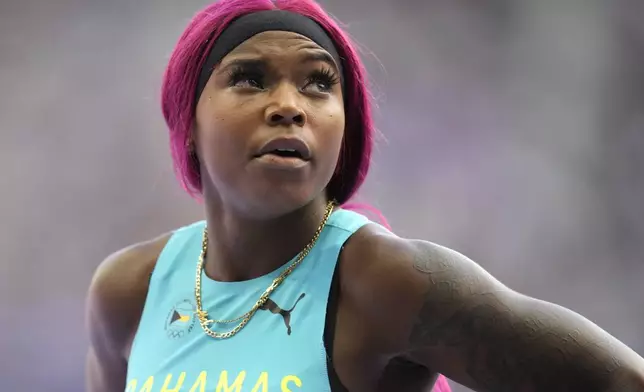 Denisha Cartwright, of Bahamas, reacts after her women's 100-meter hurdles heat at the 2024 Summer Olympics, Wednesday, Aug. 7, 2024, in Saint-Denis, France. (AP Photo/Ashley Landis)