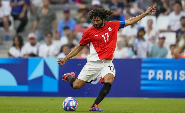 Egypt's Mohamed Elneny shoots during a men's quarterfinal soccer match between Egypt and Paraguay at the 2024 Summer Olympics, Friday, Aug. 2, 2024, at Marseille Stadium in Marseille, France. (AP Photo/Julio Cortez)