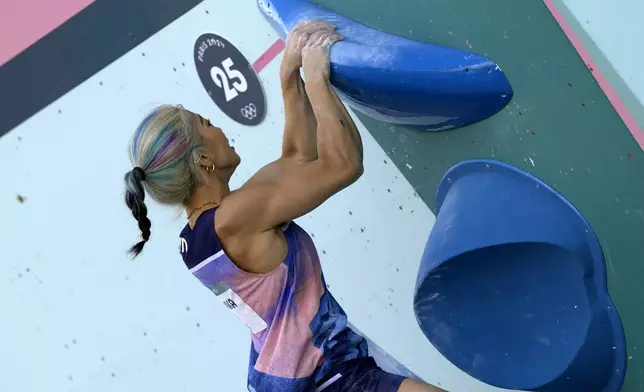 Miho Nonaka of Japan competes in the women's boulder and lead, semi-final boulder, sport climbing competition at the 2024 Summer Olympics, Tuesday, Aug. 6, 2024, in Le Bourget, France. (AP Photo/Tsvangirayi Mukwazhi)