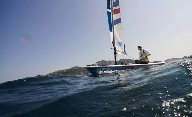 Marit Bouwmeester of the Netherlands sails back to the harbour after ILCA 6 dinghy class final race was postponed during the 2024 Summer Olympics, Tuesday, Aug. 6, 2024, in Marseille, France. (AP Photo/Jacquelyn Martin)