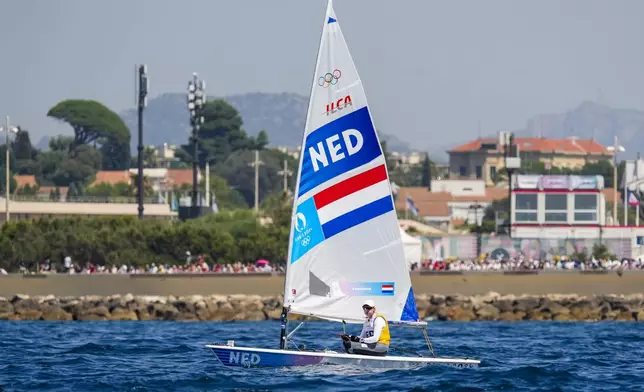 Marit Bouwmeester of the Netherlands moves to the race court prior the start of the ILCA 6 dinghy class final race during the 2024 Summer Olympics, Tuesday, Aug. 6, 2024, in Marseille, France. (AP Photo/Jacquelyn Martin)