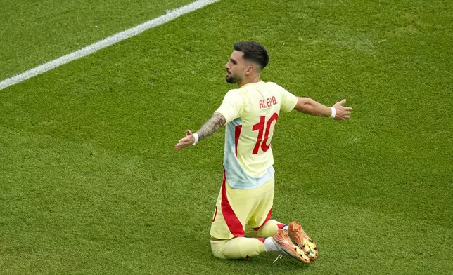 Spain's Alex Baena celebrates after scoring his side's third goal during the men's soccer gold medal match between France and Spain at the Parc des Princes during the 2024 Summer Olympics, Friday, Aug. 9, 2024, in Paris, France. (AP Photo/Vadim Ghirda)