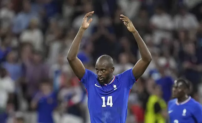 France's Jean-Philippe Mateta celebrates after scoring his side's first goal during the men's semifinal soccer match between France and Egypt, at Lyon Stadium, during the 2024 Summer Olympics, Monday, Aug. 5, 2024, in Decines, France. (AP Photo/Laurent Cipriani)