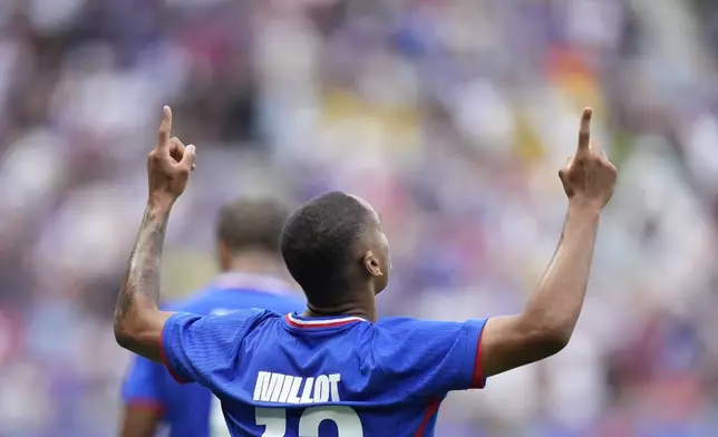 France's Enzo Millot celebrates after scoring the first goal during the men's soccer gold medal match between France and Spain at the Parc des Princes during the 2024 Summer Olympics, Friday, Aug. 9, 2024, in Paris, France. (AP Photo/Francisco Seco)