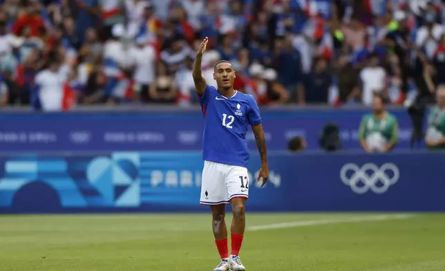 France's Enzo Millot celebrates after scoring his side's first goal during the national anthems before the men's soccer gold medal match between France and Spain at the Parc des Princes during the 2024 Summer Olympics, Friday, Aug. 9, 2024, in Paris, France. (AP Photo/Aurelien Morissard)