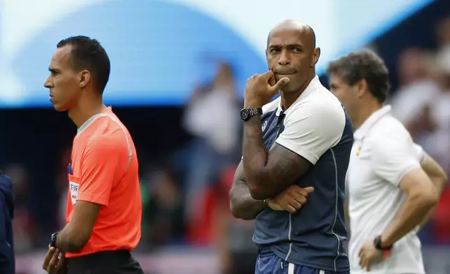 France's head coach Thierry Henry, is seen during the men's soccer gold medal match between France and Spain at the Parc des Princes during the 2024 Summer Olympics, Friday, Aug. 9, 2024, in Paris, France. (AP Photo/Aurelien Morissard)