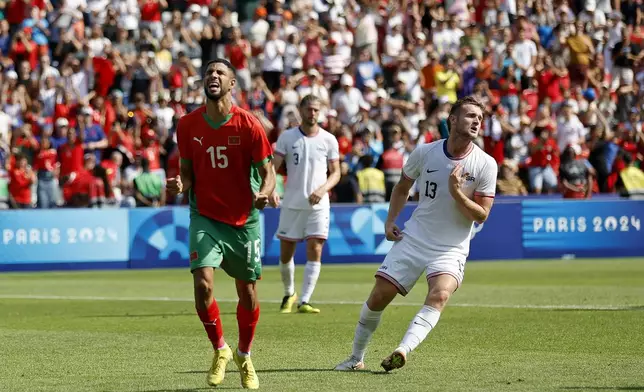 Morocco's Mehdi Maouhoub celebrates scoring his side's fourth goal during the quarterfinal men's soccer match between Morocco and the United States at the Parc des Princes during the 2024 Summer Olympics, Friday, Aug. 2, 2024, in Paris, France. (AP Photo/Aurelien Morissard)