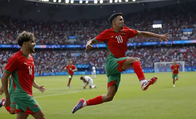 Morocco's Ilias Akhomach celebrates scoring his side's second goal during the quarterfinal men's soccer match between Morocco and the United States at the Parc des Princes during the 2024 Summer Olympics, Friday, Aug. 2, 2024, in Paris, France. (AP Photo/Aurelien Morissard)