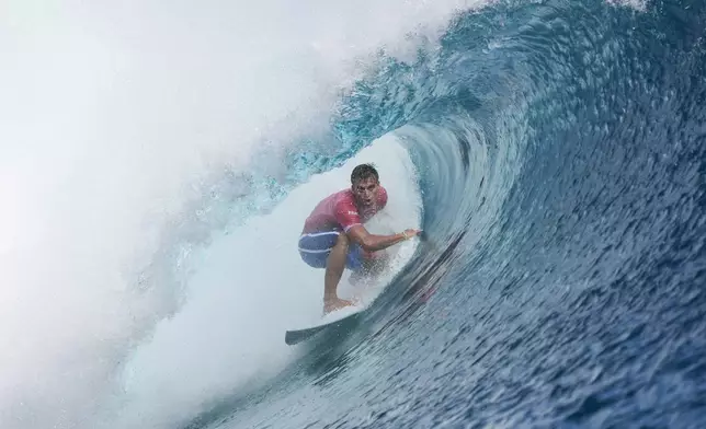 Kauli Vaast, of France, surfs during the gold medal match of the surfing competition at the 2024 Summer Olympics, Monday, Aug. 5, 2024, in Teahupo'o, Tahiti. (AP Photo/Gregory Bull)