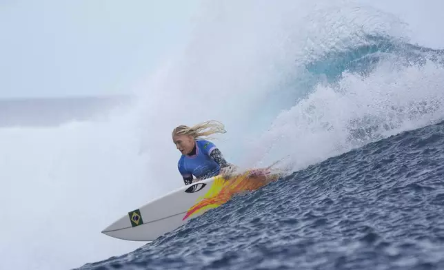 Tatiana Weston-Webb, of Brazil, surfs during the gold medal match of the surfing competition at the 2024 Summer Olympics, Monday, Aug. 5, 2024, in Teahupo'o, Tahiti. (AP Photo/Gregory Bull)