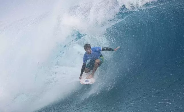 Jack Robinson, of Australia, surfs during the gold medal match of the surfing competition at the 2024 Summer Olympics, Monday, Aug. 5, 2024, in Teahupo'o, Tahiti. (AP Photo/Gregory Bull)