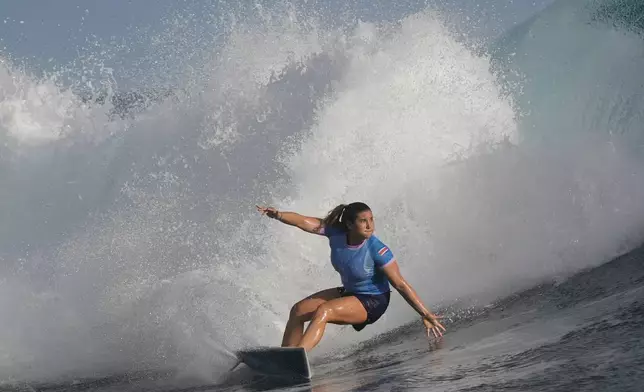 Brisa Hennessy, of Costa Rica, surfs during the quarterfinals round of the 2024 Summer Olympics surfing competition, Thursday, Aug. 1, 2024, in Teahupo'o, Tahiti. (AP Photo/Gregory Bull)