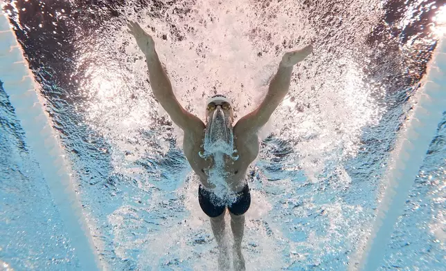 Petar Petrov Mitsin, of Bulgaria, competes during a heat in the men's 200-meter butterfly at the 2024 Summer Olympics, Tuesday, July 30, 2024, in Nanterre, France. (AP Photo/David J. Phillip)