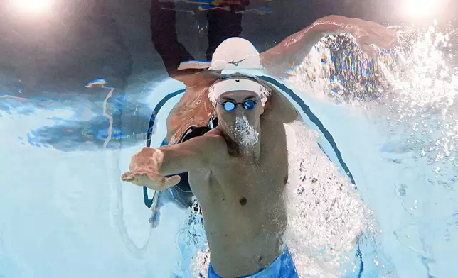 Mikel Schreuders, of Aruba, competes during a heat in the men's 100-meter freestyle at the 2024 Summer Olympics, Tuesday, July 30, 2024, in Nanterre, France. (AP Photo/David J. Phillip)