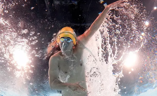 Nixon Hernandez, of El Salvador, competes during a heat in the men's 100-meter freestyle at the 2024 Summer Olympics, Tuesday, July 30, 2024, in Nanterre, France. (AP Photo/David J. Phillip)