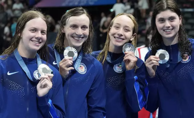 United States' women's 4x200-meter freestyle relay team pose with their silver medals at the 2024 Summer Olympics, Thursday, Aug. 1, 2024, in Nanterre, France. (AP Photo/Matthias Schrader)