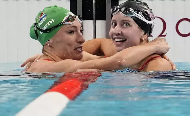 Kate Douglass, right, of the United States, is congratulated by Tatjana Smith, of South Africa, after winning the women's 200-meter breaststroke final at the 2024 Summer Olympics, Thursday, Aug. 1, 2024, in Nanterre, France. (AP Photo/Matthias Schrader)