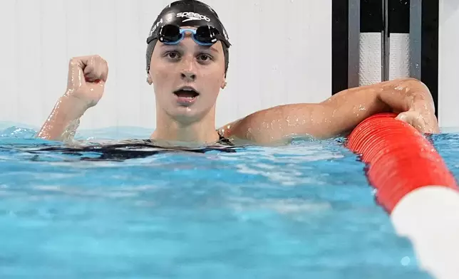 Summer McIntosh, of Canada, reacts after winning the women's 200-meter butterfly final at the 2024 Summer Olympics, Thursday, Aug. 1, 2024, in Nanterre, France. (AP Photo/Matthias Schrader)