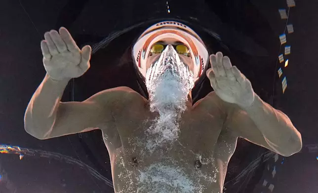 Petar Petrov Mitsin, of Bulgaria, competes during a heat in the men's 200-meter butterfly at the 2024 Summer Olympics, Tuesday, July 30, 2024, in Nanterre, France. (AP Photo/David J. Phillip)