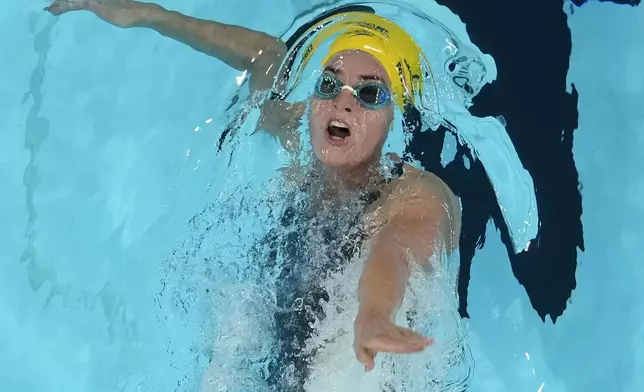 Kaylee McKeown, of Australia, competes during a heat in the women's 100-meter backstroke at the 2024 Summer Olympics, Monday, July 29, 2024, in Nanterre, France. (AP Photo/David J. Phillip)