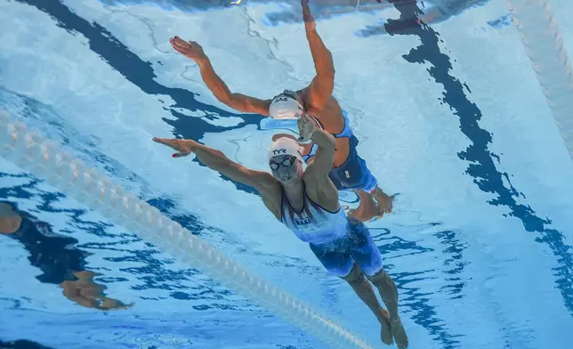 Torri Huske, of the United States, competes in the women's 100-meter butterfly semifinal at the 2024 Summer Olympics, Saturday, July 27, 2024, in Nanterre, France. (AP Photo/David J. Phillip)