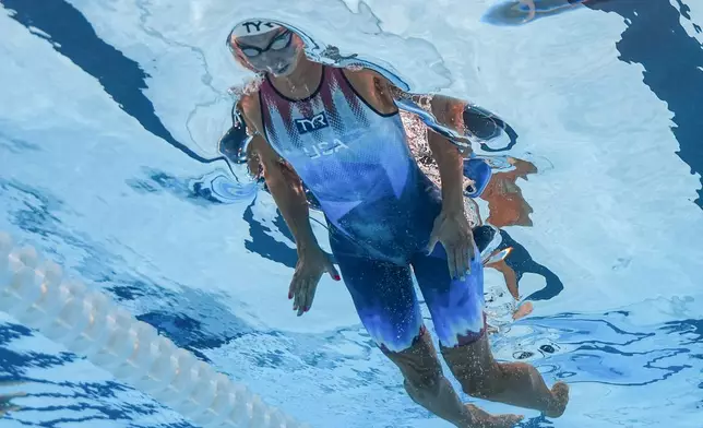 Torri Huske, of the United States, competes in the women's 100-meter butterfly semifinal at the 2024 Summer Olympics, Saturday, July 27, 2024, in Nanterre, France. (AP Photo/David J. Phillip)