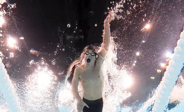 Leo Nolles, of Uruguay, competes during a heat in the men's 100-meter freestyle at the 2024 Summer Olympics, Tuesday, July 30, 2024, in Nanterre, France. (AP Photo/David J. Phillip)