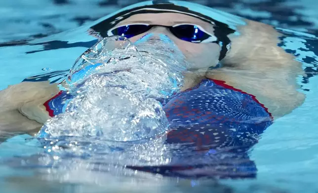 Katharine Berkoff, of the United States, competes during a women's 100-meter backstroke semifinal at the 2024 Summer Olympics, Monday, July 29, 2024, in Nanterre, France. (AP Photo/Matthias Schrader)