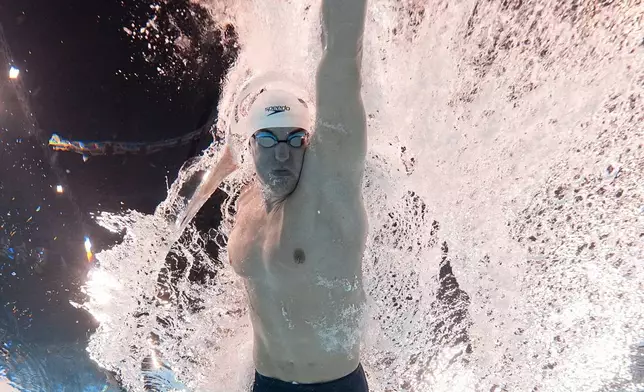 Jack Alexy, of the United States, competes during a heat in the men's 100-meter freestyle at the 2024 Summer Olympics, Tuesday, July 30, 2024, in Nanterre, France. (AP Photo/David J. Phillip)