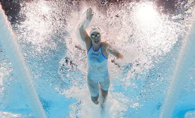 Paige van der Westhuizen, of Zimbabwe, competes during a heat in the women's 100-meter freestyle at the 2024 Summer Olympics, Tuesday, July 30, 2024, in Nanterre, France. (AP Photo/David J. Phillip)